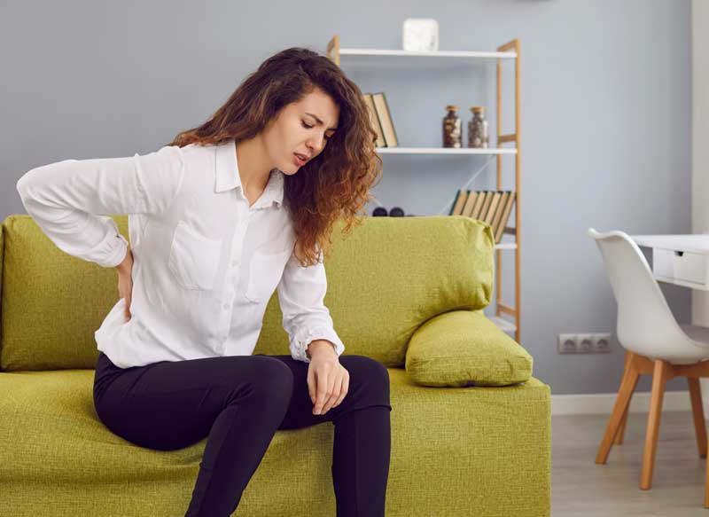 Woman experiencing lower back pain - Chiropractor for Sciatica in Draper, UT Woman experiencing lower back pain - Chiropractor for Sciatica in Draper, UT