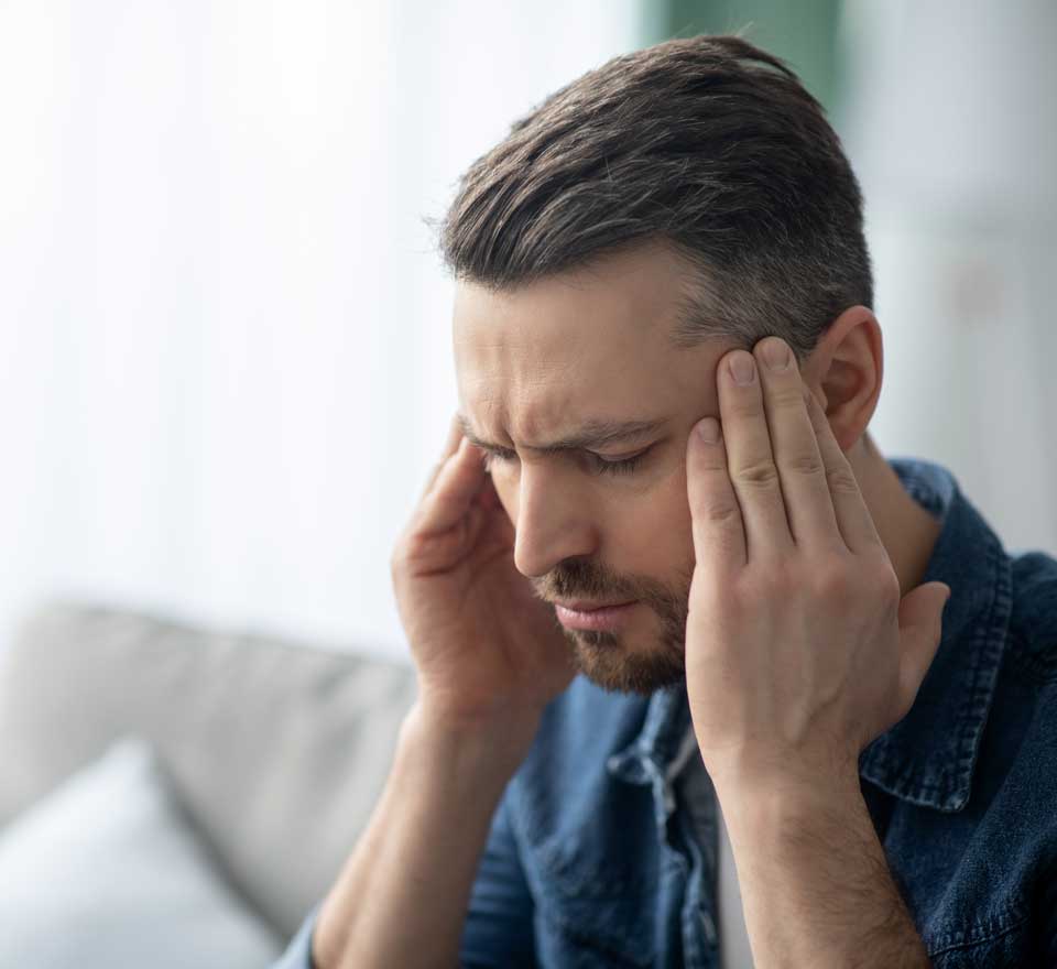 Man having a migraine - Chiropractor for Migraines in Draper, UT Man having a migraine - Chiropractor for Migraines in Draper, UT